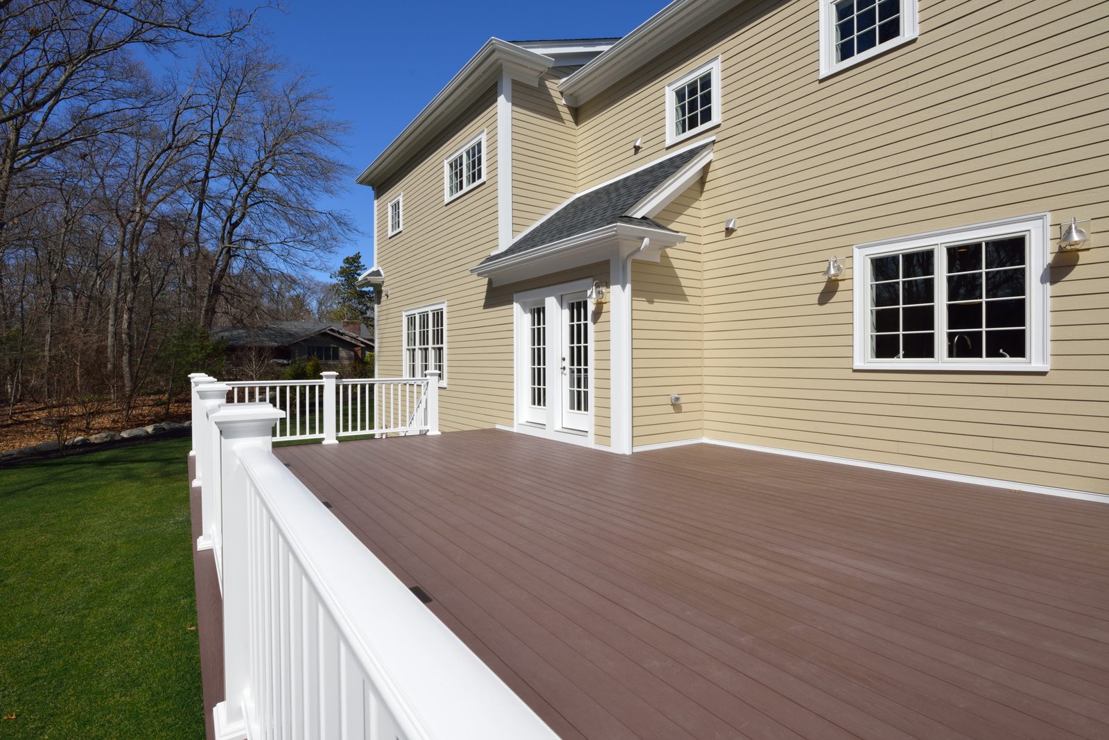 Large New Deck in House Backyard Vinyl Decking